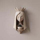 3D printed wall decoration showing a stylized fairy head above a small planter holder
