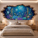 Wall sticker artwork featuring jellyfish, tropical fish and colorful coral behind a cracked wall opening