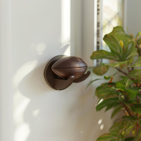 3D printed football wall display featuring a decorative football with matching curved wall mount