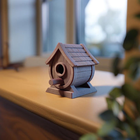 3D printed rustic birdhouse ornament featuring a round body, textured roof and short perch