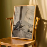 African Grey Parrot Reading in Bed depicted in a japanese zen ink wash art poster