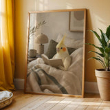 Lutino Cockatiel Reading in Bed shown in a modern soft gouache wall art print