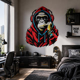 Gorilla wearing red headphones wall sticker above a dark bed near gaming room shelves.