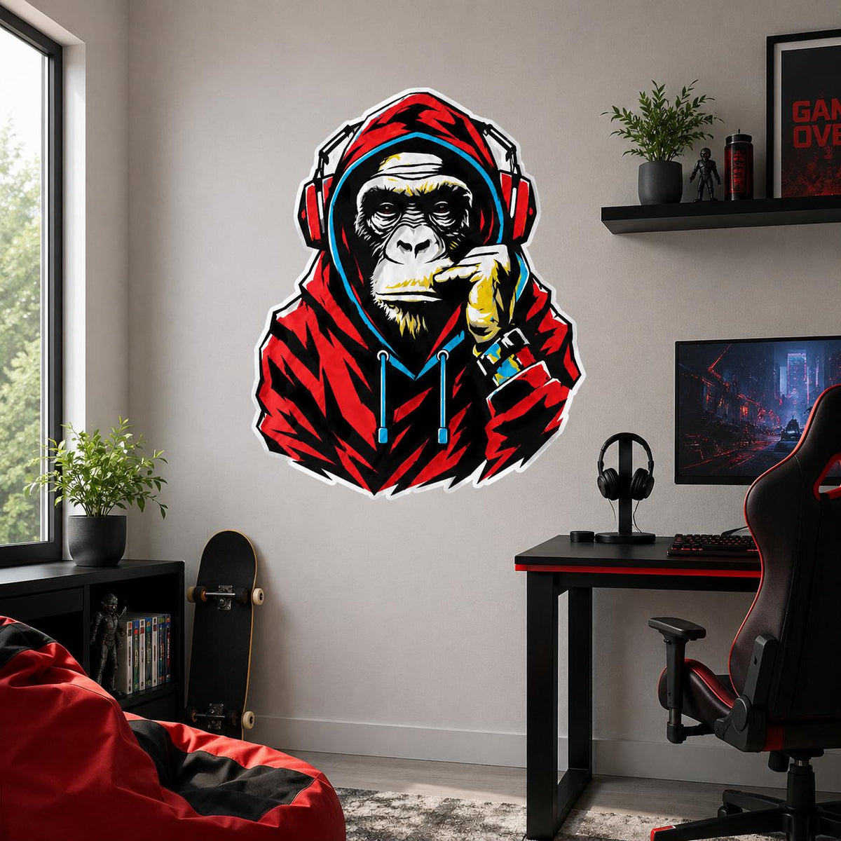 Red and black headphone-wearing gorilla wall decal above a computer gaming desk.