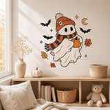 Wall sticker composition featuring a friendly white ghost in an orange hat and striped scarf holding a pumpkin