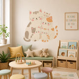 Printed vinyl design showing five cuddling cream and peach cartoon cats with pink cheeks