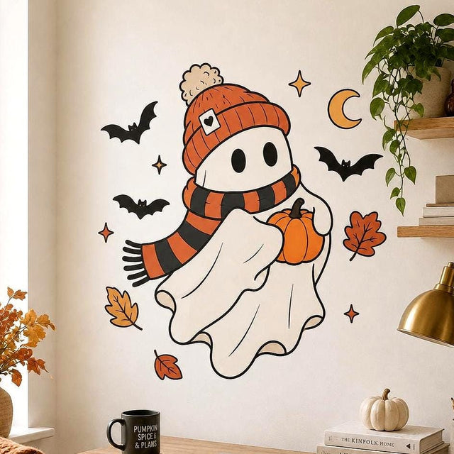 Cute Halloween ghost wall decal wearing an orange beanie and striped scarf, holding a pumpkin among bats, stars and leaves.
