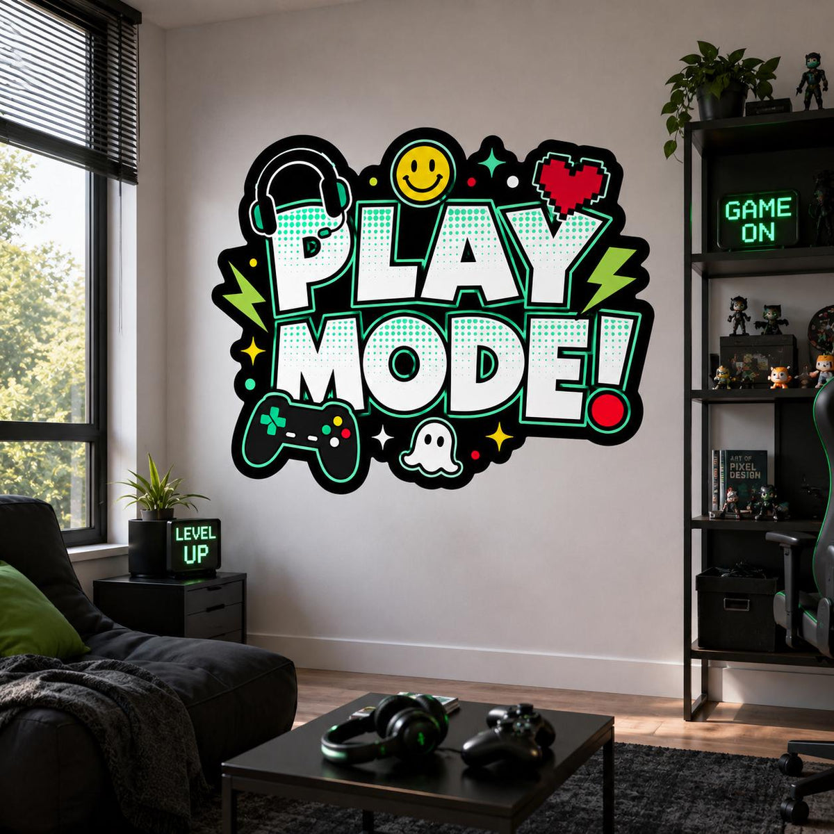 Play Mode wall decal above a dark sofa and coffee table with video game controllers in a gaming room.