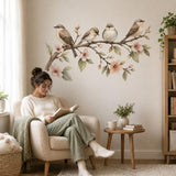 Wall sticker composition featuring four small birds on a flowering branch with peach blossoms and green leaves