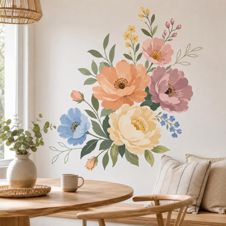 Pastel floral wall decal featuring peach, cream, dusty pink and blue flowers with buds and muted green leaves.