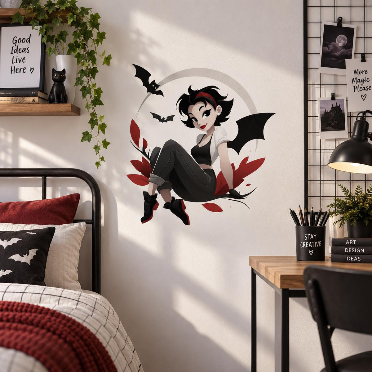 Gothic bat girl and crescent moon wall decal above a black bed with burgundy bedding.