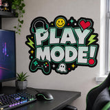 Play Mode wall decal above a black gaming desk with a monitor, keyboard and chair beside a window.