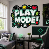 Play Mode gaming wall sticker above a computer desk and bed, next to a gaming chair in a bright bedroom.