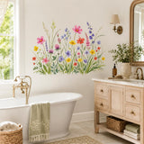 Watercolor wildflower wall decal with pink, coral, yellow and violet meadow flowers among tall green grasses