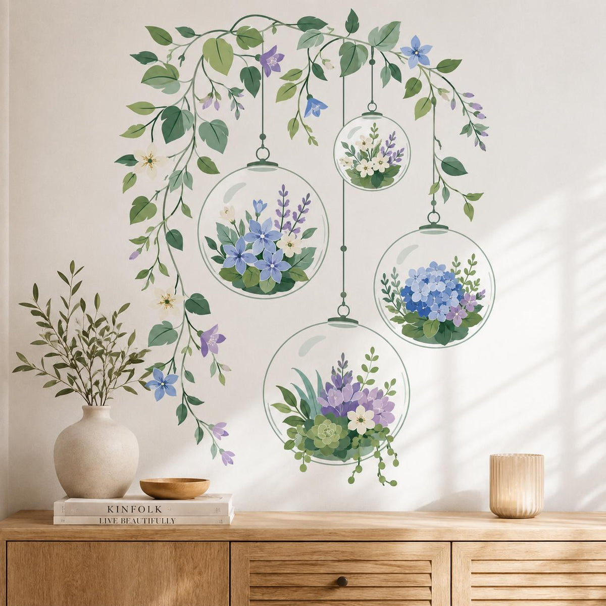 Four hanging glass terrarium wall decals filled with flowers and succulents beneath trailing leafy vines.