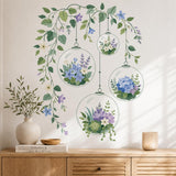 Four hanging glass terrarium wall decals filled with flowers and succulents beneath trailing leafy vines.