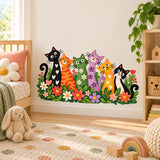 Six colorful cartoon cats among flowers wall decal beside a nursery bed and plush rabbit.