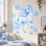 Icy blue rearing unicorn wall decal with snowflakes above a bed with fluffy blue cushions.