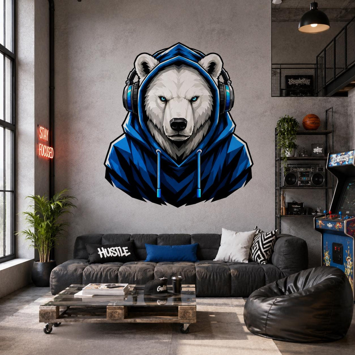 Blue-hooded polar bear gamer wall sticker above a charcoal sofa in an industrial loft.