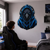 Person seated at a gaming desk below a raven with headphones wall decal.