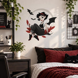 Gothic girl with bats wall sticker above a bed next to a wood nightstand and framed artwork.