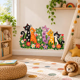 Floral garden wall sticker with six colorful cats above a playroom rug and woven toy basket.