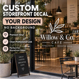 Custom white vinyl storefront window decal with Willow & Co. Cafe leaf logo and lettering applied directly to clear shop glass.
