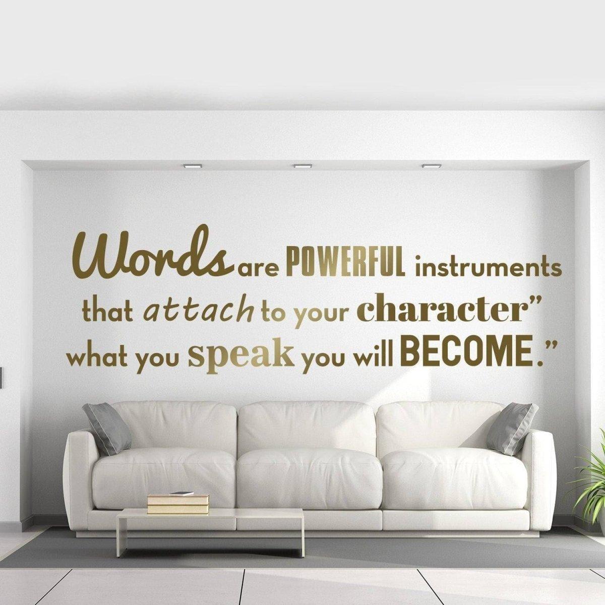 Inspirational wall vinyl decal with motivational quote on a bright wall above a modern couch.