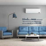 Motivational wall decal featuring the quote about powerful words in a stylish living room setting.