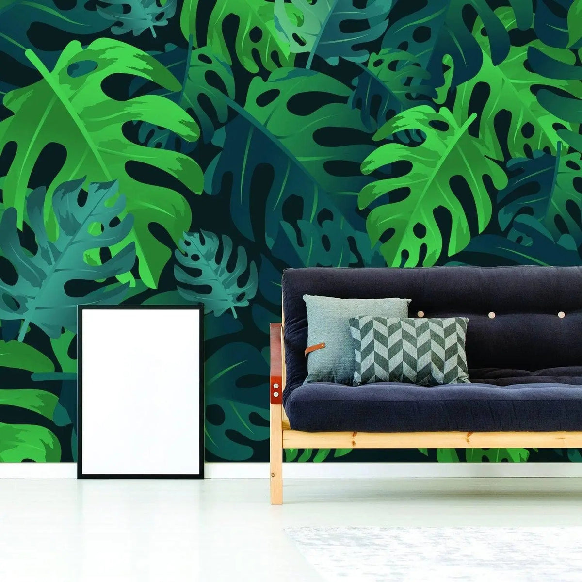 Tropical Paradise Peel and Stick Wallpaper featuring lush green leaves in a stylish living room with a modern couch.
