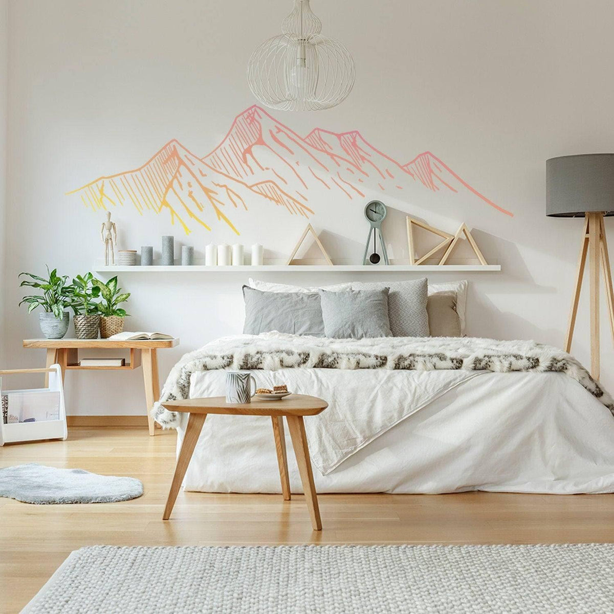 Stylish bedroom with Nature's Majesty Mountain Silhouette Wall Sticker above a cozy bed and modern decor.