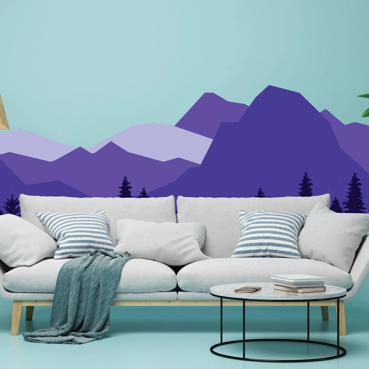 Vibrant purple mountain wall decal behind a cozy sofa, enhancing room decor with nature-inspired design.