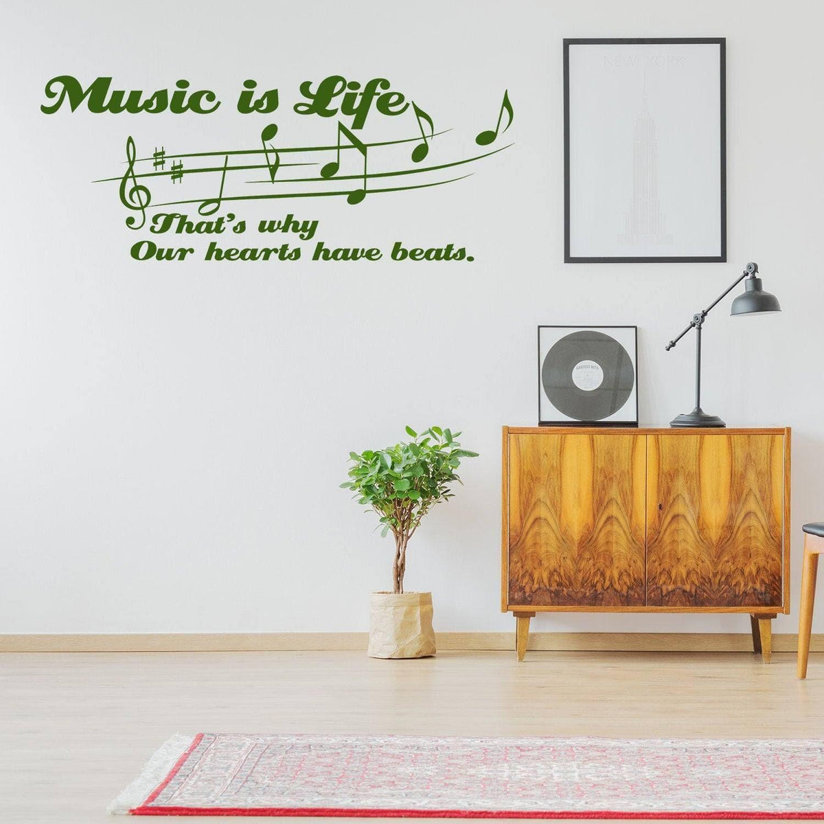 Vinyl wall decal with "Music is Life" quote and musical notes in a modern interior setting.