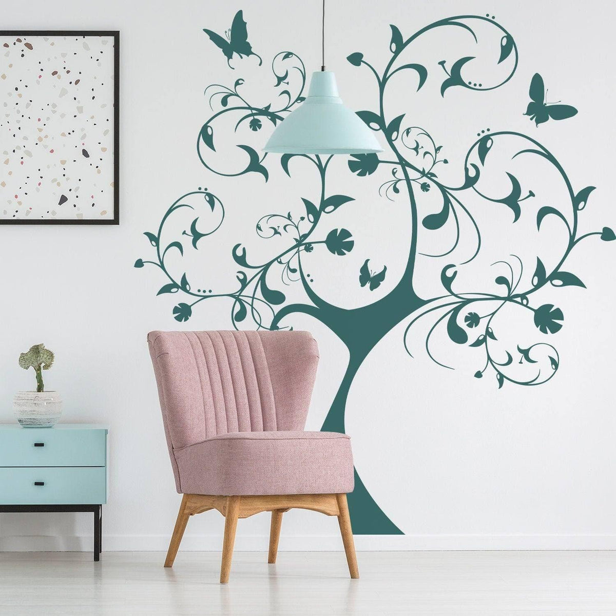 Nature's Delight Tree Wall Sticker in a cozy room with a pink chair, enhancing indoor decor with floral designs.