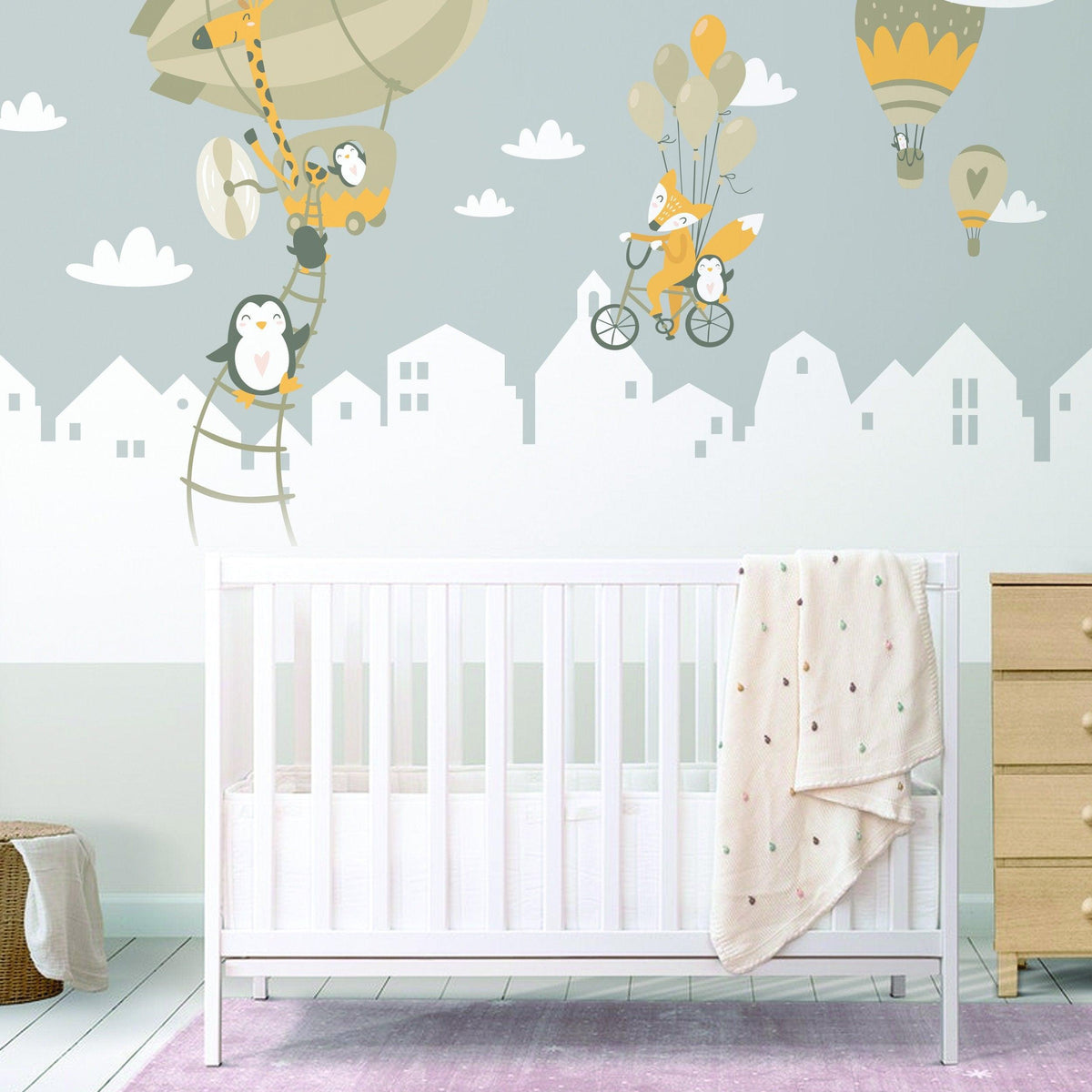Whimsical animal wall stickers featuring penguins and a fox with hot air balloons.