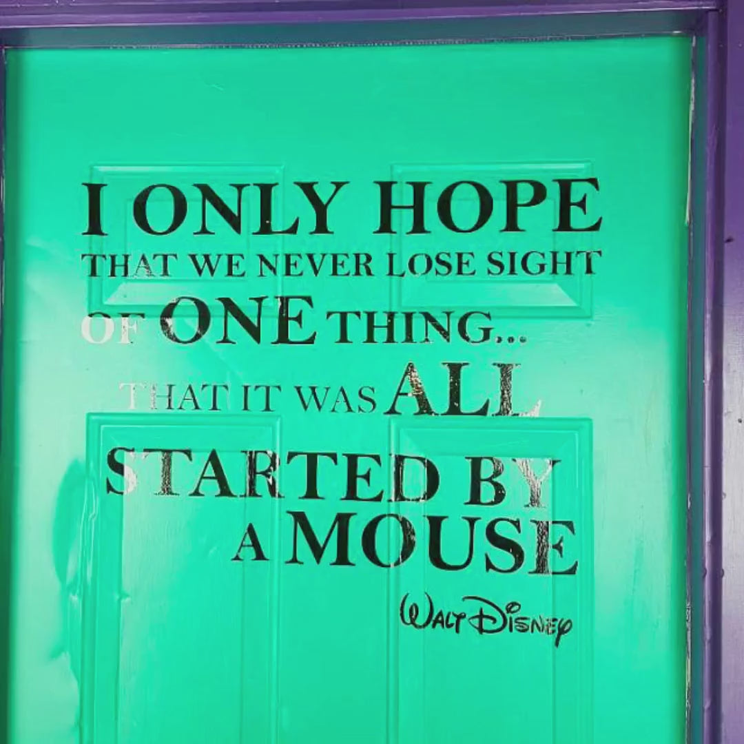 Custom inspirational quote wall decal shown on a green door.
