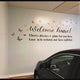 Welcome home wall decal with butterflies in a cozy space, inviting comfort and warmth.