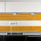 Rustic wood plank peel and stick wallpaper in a modern kitchen with sleek cabinetry and a stylish sink.