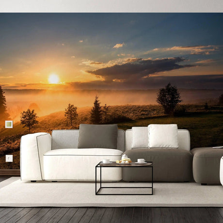 Scenic sunset wall decals transforming a cozy living room with soft furniture and a warm atmosphere.