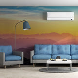 Modern living room featuring Nature's Serenade Sunset Wall Decals with blue sofas and a chic floor lamp.
