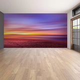 Sunset wall decal showcasing vibrant colors in a serene beach setting.