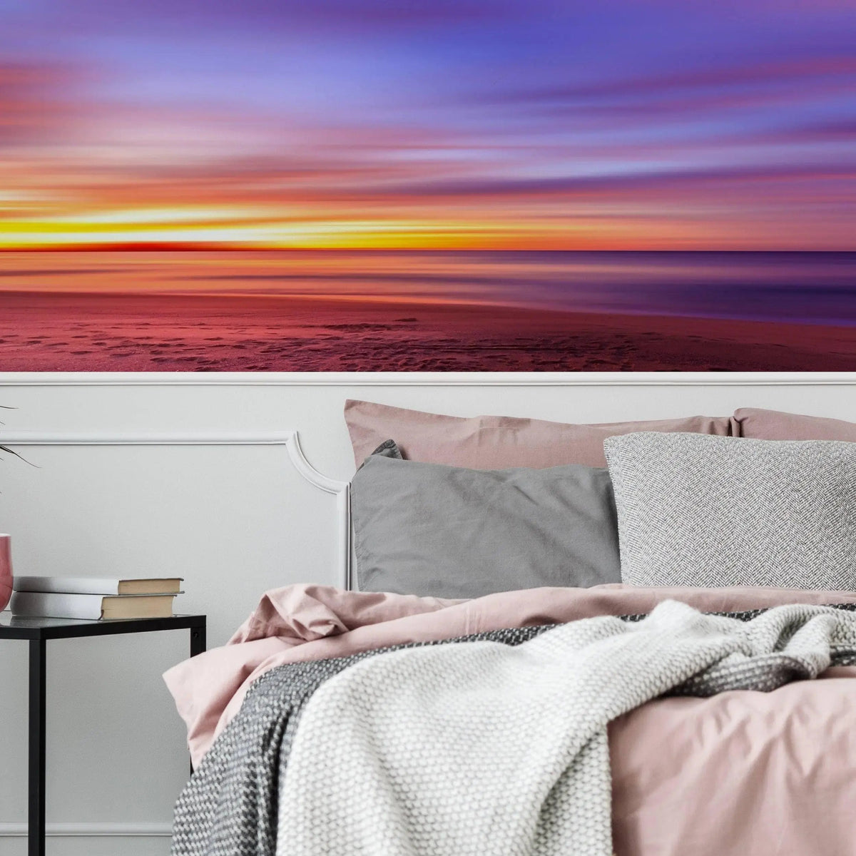 Stunning sunset wall decals creating a serene atmosphere in a cozy bedroom with soft bedding.