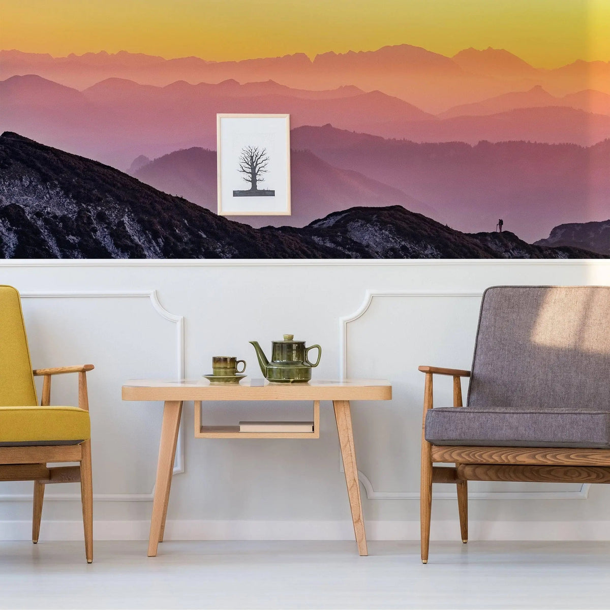 Transformative sunset wall decals showcasing vibrant mountain landscape in stylish living room decor.