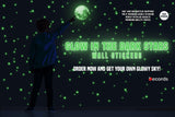 Child reaching for glowing moon and stars wall stickers in a dark room, featuring 222 glow-in-the-dark pieces.