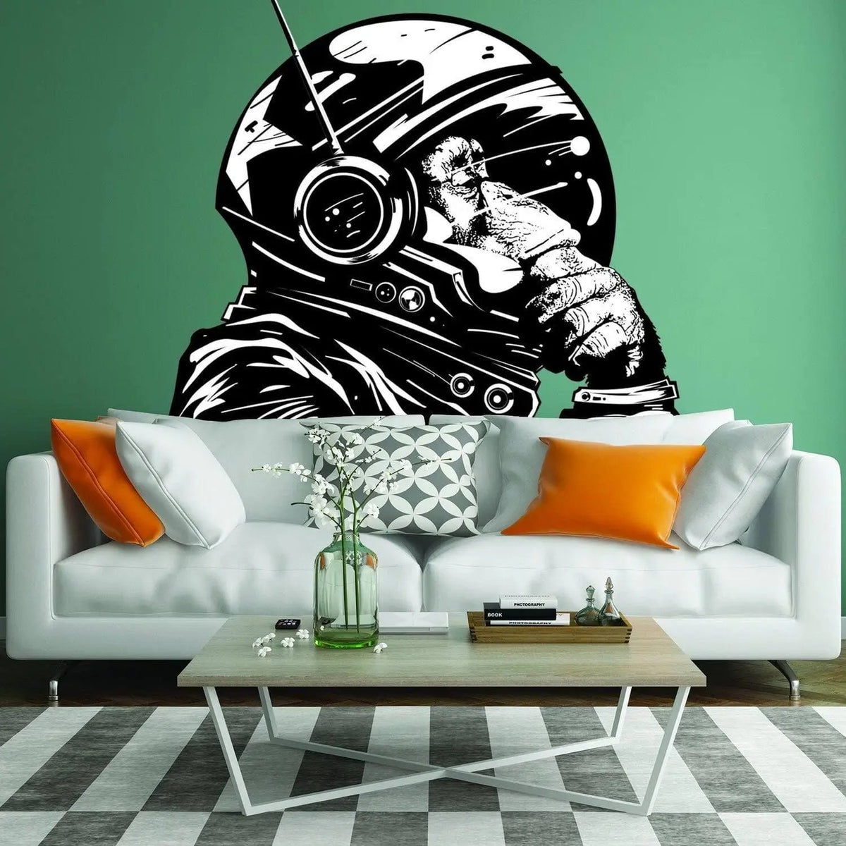 Astronaut monkey wall decal on green wall above a modern sofa in a stylish living room.