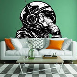 Astronaut monkey wall decal on green wall above a modern sofa in a stylish living room.