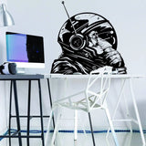 Monkey astronaut wall decal in a modern workspace, adding creativity to kid's room decor.