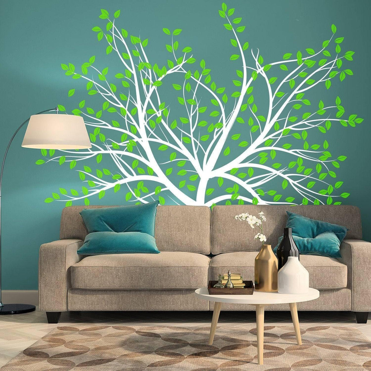 Nature's Serenity vinyl wall decal featuring a tree design with green leaves on a teal wall above a modern sofa.