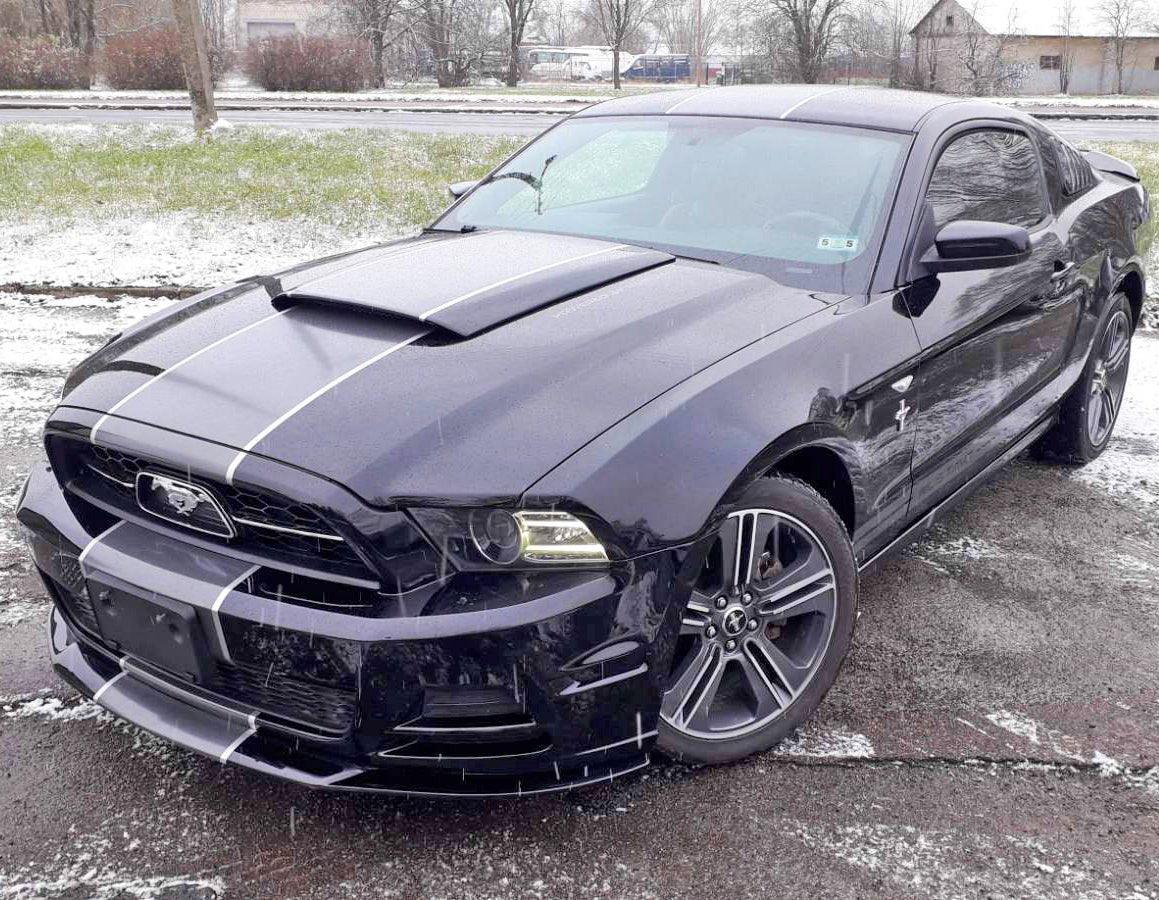 Sleek black car with racing stripes decals, showcasing a stylish upgrade for any vehicle.