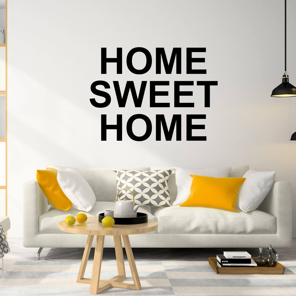 Home Sweet Home wall decal above a stylish couch, creating a warm and inviting living space.